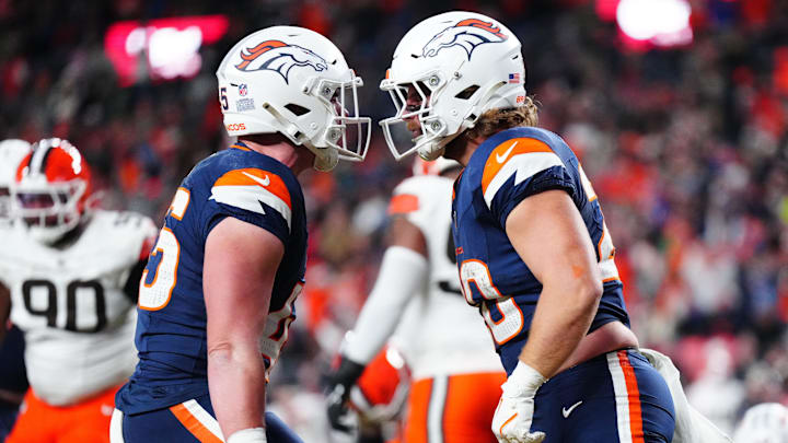 Dec 2, 2024; Denver, Colorado, USA; Denver Broncos fullback Michael Burton (20) celebrates his touchdown with tight end Nate Adkins (45) in the second quarter against the Cleveland Browns at Empower Field at Mile High. Dec 2, 2024; Denver, Colorado, USA; Denver Broncos fullback Michael Burton (20) celebrates his touchdown with tight end Nate Adkins (45) in the second quarter against the Cleveland Browns at Empower Field at Mile High.