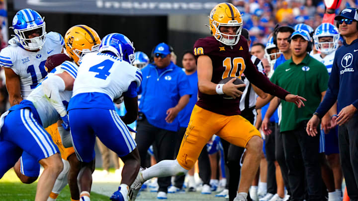 Arizona State quarterback Sam Leavitt (10) sprints out of bounds during the second half against BYU at Mountain America Stadium in Tempe on Nov. 23, 2024.