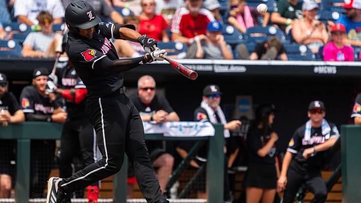 Jun 17, 2025; Omaha, Neb, USA; Louisville Cardinals third baseman Jake Munroe (20) hits a two-run home run against the Oregon State Beavers during the third inning at Charles Schwab Field. Mandatory Credit: Dylan Widger-Imagn Images Jun 17, 2025; Omaha, Neb, USA; Louisville Cardinals third baseman Jake Munroe (20) hits a two-run home run against the Oregon State Beavers during the third inning at Charles Schwab Field. Mandatory Credit: Dylan Widger-Imagn Images
