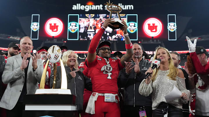 Dec 31, 2025; Las Vegas, NV, USA; Utah Utes quarterback Devon Dampier (4) holds the most valuable player trophy after victory over Nebraska Cornhuskers in the SRS Distribution Las Vegas Bowl at Allegiant Stadium. Mandatory Credit: Kirby Lee-Imagn Images