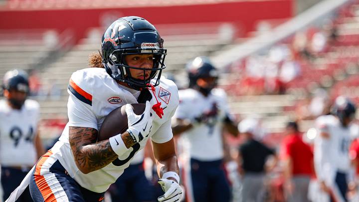 Sep 6, 2025; Raleigh, North Carolina, USA; Virginia Cavaliers warm up before the game against NC State Wolfpack at Carter-Finley Stadium. Mandatory Credit: Jaylynn Nash-Imagn Images