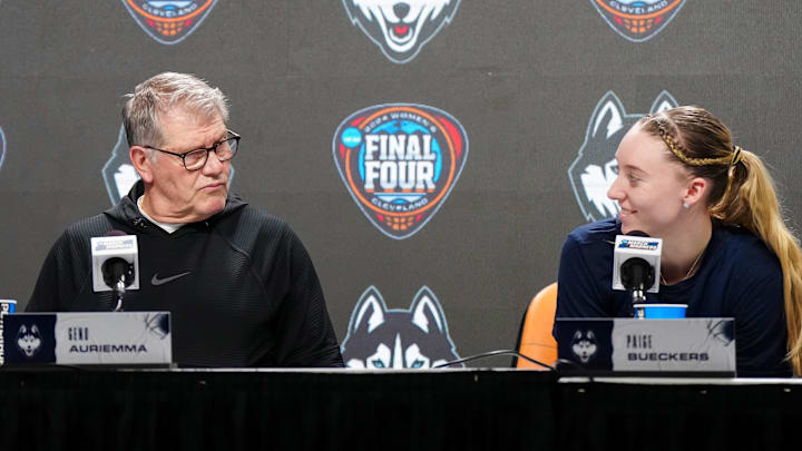 Apr 4, 2024; Cleveland, OH, USA; UConn Huskies coach Geno Auriemma (left) and guard Paige Bueckers during press conference at Rocket Mortgage FieldHouse. Mandatory Credit: Kirby Lee-Imagn Images