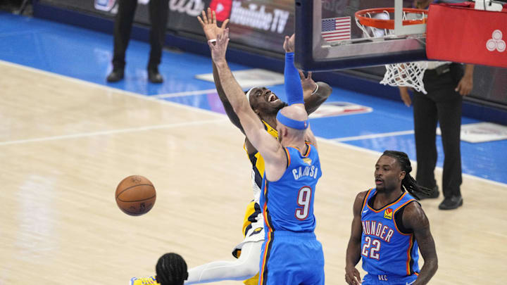 Jun 22, 2025; Oklahoma City, Oklahoma, USA; Indiana Pacers forward Pascal Siakam (43) loses control of the ball against Oklahoma City Thunder guard Alex Caruso (9) during the first half of game seven of the 2025 NBA Finals at Paycom Center. Mandatory Credit: Kyle Terada-Imagn Images