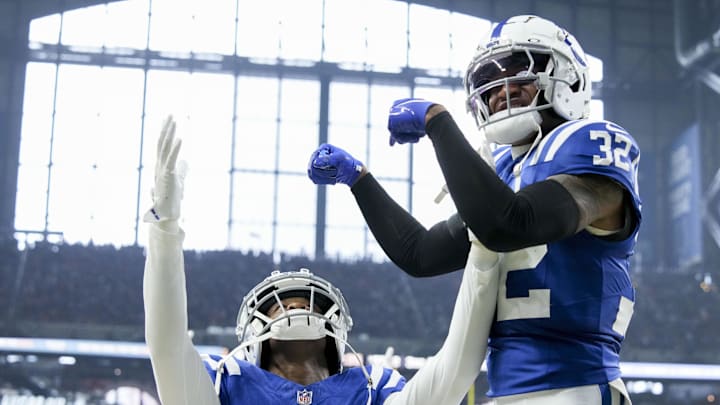 Sep 22, 2024; Indianapolis, Indiana, USA; Indianapolis Colts safety Julian Blackmon (32) celebrates with Indianapolis Colts cornerback Jaylon Jones (40) and Jones’ interception during a game against the Chicago Bears at Lucas Oil Stadium. Mandatory Credit: Grace Hollars USA TODAY Network via Imagn Images