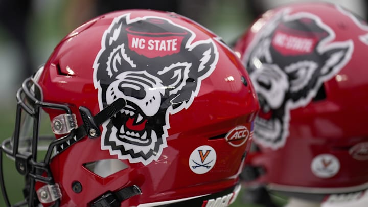 Dec 30, 2022; Charlotte, NC, USA; North Carolina State Wolfpack helmets during the first half against the Maryland Terrapins in the 2022 Duke's Mayo Bowl at Bank of America Stadium. Mandatory Credit: Jim Dedmon-Imagn Images