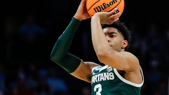 Michigan State guard Jaden Akins (3) makes a jump shot against North Carolina guard Paxson Wojcik (8) during the first half of the NCAA tournament West Region second round at Spectrum Center in Charlotte, N.C. on Saturday, March 23, 2024.