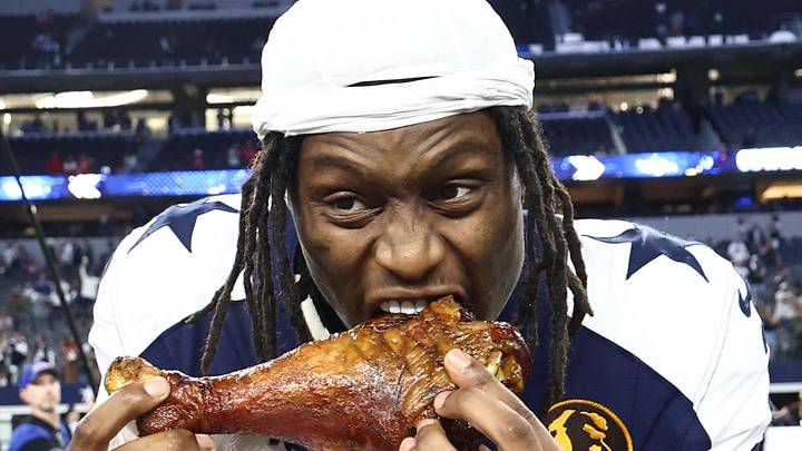 Nov 27, 2025; Arlington, Texas, USA; Dallas Cowboys wide receiver George Pickens (3) celebrates by eating turkey after the game against the Kansas City Chiefs at AT&T Stadium. Mandatory Credit: Kevin Jairaj-Imagn Images