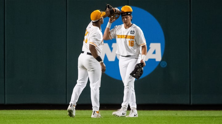 Tennessee's Kavares Tears (21) puts a baseball hat back on the head of Tennessee's Dalton Bargo (16) after Bargo made a catch during game one of the NCAA College World Series finals between Tennessee and Texas A&M at Charles Schwab Field in Omaha, Neb., on Saturday, June 22, 2024. Tennessee's Kavares Tears (21) puts a baseball hat back on the head of Tennessee's Dalton Bargo (16) after Bargo made a catch during game one of the NCAA College World Series finals between Tennessee and Texas A&M at Charles Schwab Field in Omaha, Neb., on Saturday, June 22, 2024.