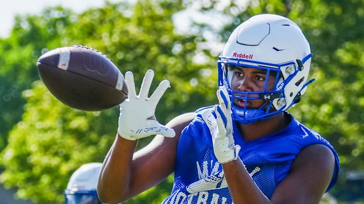 Isaac Miller makes a catch during football practice at Catholic Memorial High School on Wednesday, August 7, 2024. Isaac Miller makes a catch during football practice at Catholic Memorial High School on Wednesday, August 7, 2024.