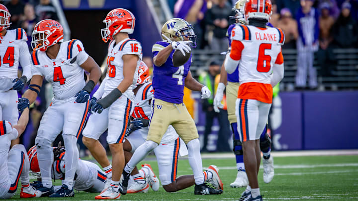 Jordan Washington emerges from a pile in the UW-Illinois game. 
