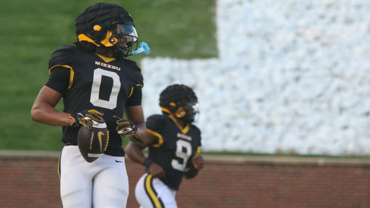 Aug. 17, 2024: Columbia, Missouri; Missouri Tigers wide receiver Joshua Manning looks back to the left sideline at the team's annual fan night practice at Faurot Field. Aug. 17, 2024: Columbia, Missouri; Missouri Tigers wide receiver Joshua Manning looks back to the left sideline at the team's annual fan night practice at Faurot Field.