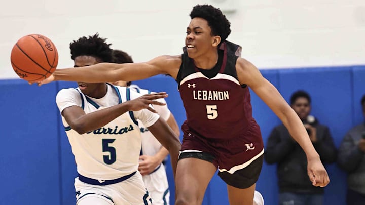 Lebanon forward Anthony Thompson (5) chases after a loose ball during their during their 50-61 loss to Winton Woods Friday, Jan. 5, 2024.
