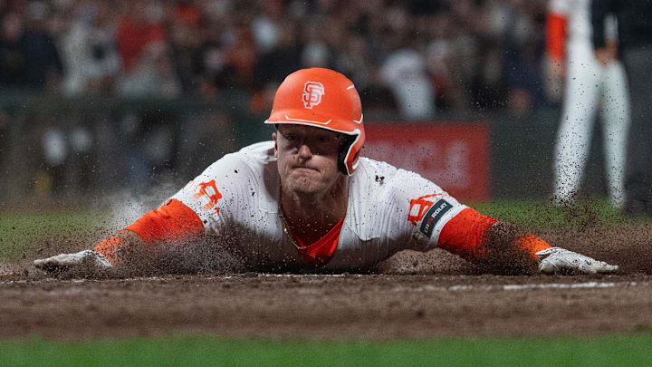 May 28, 2024; San Francisco, California, USA;  San Francisco Giants shortstop Tyler Fitzgerald (49) slides into home plate to defeat the Philadelphia Phillies at Oracle Park.