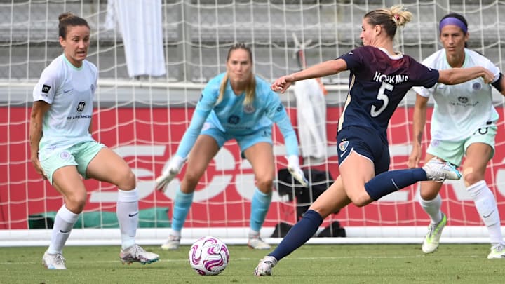 Sep 9, 2023; Cary, North Carolina, USA; North Carolina Courage forward Haley Hopkins (5) shoots as Racing Louisville FC defender Julia Lester (15) and goalkeeper Katie Lund (1) and defender Abby Erceg (20) defend in the second half at WakeMed Soccer Park. Mandatory Credit: Bob Donnan-USA TODAY Sports