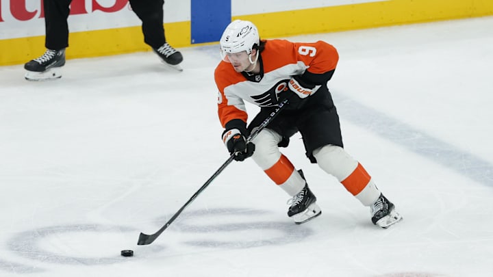 Feb 4, 2025; Salt Lake City, Utah, USA;  Philadelphia Flyers defenseman Jamie Drysdale (9) brings the puck up the ice during the third period against the Utah Hockey Club at Delta Center. Mandatory Credit: Chris Nicoll-Imagn Images