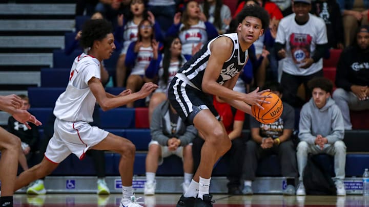 Serra's Maximo Adams (25) looks to pass while guarded by Indio's Jerry Perkins (1) during the first quarter of their first-round CIF-SS playoff game at Indio High School in Indio, Calif., Wednesday, Feb. 7, 2024.