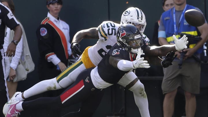 Green Bay Packers cornerback Keisean Nixon (25) breaks up a mpass to Houston Texans receiver Stefon Diggs at Lambeau Field.