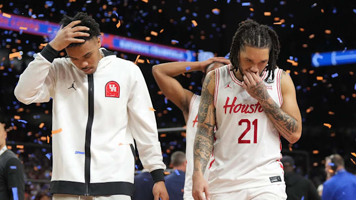 Houston players walk off the court after losing to Florida in the national title game Monday night.