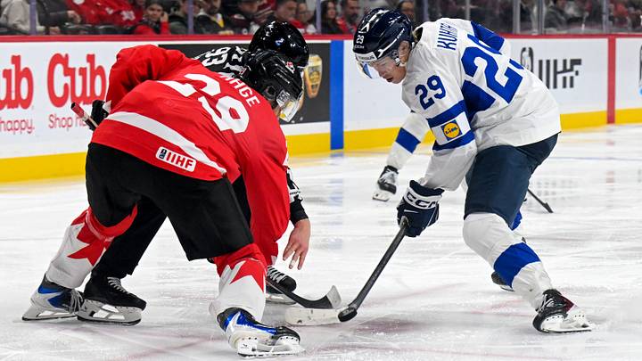 Jan 5, 2026; St. Paul, Minnesota, USA; Canada forward Michael Hage (29) and Finland forward Jasper Kuhta (29) face-off during the third period in the third place game of the 2026 IIHF World Junior Championship ice hockey tournament at Grand Casino Arena. Mandatory Credit: Nick Wosika-Imagn Images