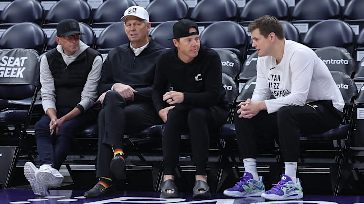 Feb 6, 2024; Salt Lake City, Utah, USA; From left to right, Utah Jazz general manager Justin Zanik, CEO Danny Ainge, owner Ryan Smith and head coach Will Hardy sit court side before the game between the Utah Jazz and the Oklahoma City Thunder at Delta Center. Mandatory Credit: Rob Gray-Imagn Images