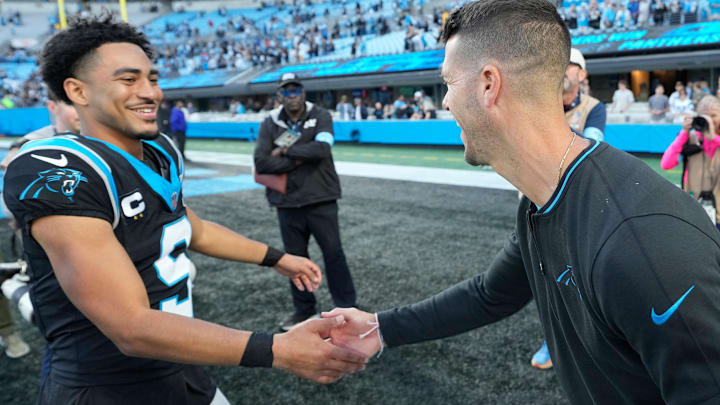 Nov 3, 2024; Charlotte, North Carolina, USA; Carolina Panthers quarterback Bryce Young (9) with head coach Dave Canales after the game at Bank of America Stadium. Nov 3, 2024; Charlotte, North Carolina, USA; Carolina Panthers quarterback Bryce Young (9) with head coach Dave Canales after the game at Bank of America Stadium.