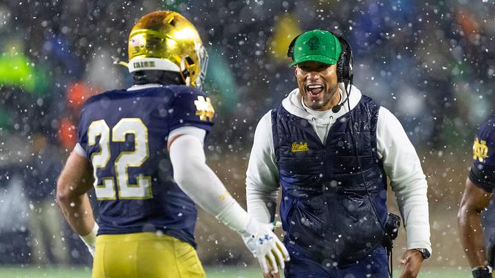 Nov 8, 2025; South Bend, Indiana, USA; Notre Dame Fighting Irish head coach Marcus Freeman celebrates with running back Aneyas Williams (22) after he scored a touchdown against the Navy Midshipmen during the second half at Notre Dame Stadium. Mandatory Credit: Michael Caterina-Imagn Images