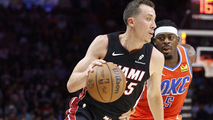 Dec 20, 2024; Miami, Florida, USA; Oklahoma City Thunder guard Luguentz Dort (5) defends Miami Heat forward Duncan Robinson (55) during the second half at Kaseya Center. Mandatory Credit: Rhona Wise-Imagn Images Dec 20, 2024; Miami, Florida, USA; Oklahoma City Thunder guard Luguentz Dort (5) defends Miami Heat forward Duncan Robinson (55) during the second half at Kaseya Center. Mandatory Credit: Rhona Wise-Imagn Images