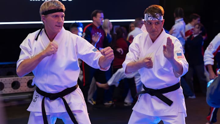 William Zabka as Johnny Lawrence, Ralph Macchio as Daniel LaRusso in Cobra Kai. Cr. Curtis Bonds Baker/Netflix © 2024