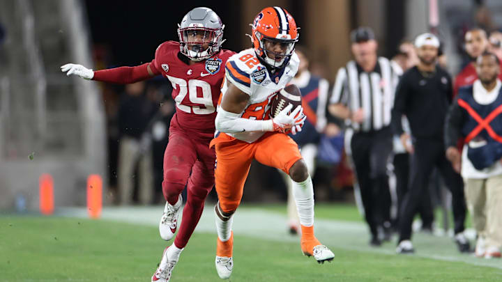 Dec 27, 2024; San Diego, CA, USA;  Syracuse Orange wide receiver Darrell Gill Jr. (82) catches the ball against Washington State Cougars defensive back Jamorri Colson (29) during the second half at Snapdragon Stadium. Mandatory Credit: Abe Arredondo-Imagn Images