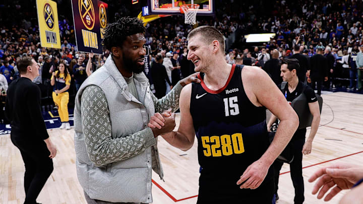 Jan 27, 2024; Denver, Colorado, USA; Philadelphia 76ers center Joel Embiid (21) and Denver Nuggets center Nikola Jokic (15) after the game at Ball Arena. Mandatory Credit: Isaiah J. Downing-Imagn Images