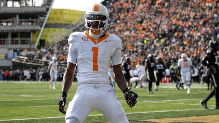 Nov 30, 2024; Nashville, Tennessee, USA;  Tennessee Volunteers wide receiver Dont'e Thornton Jr. (1) celebrates his touchdown with his teammates against the Vanderbilt Commodores during the first half at FirstBank Stadium. Mandatory Credit: Steve Roberts-Imagn Images