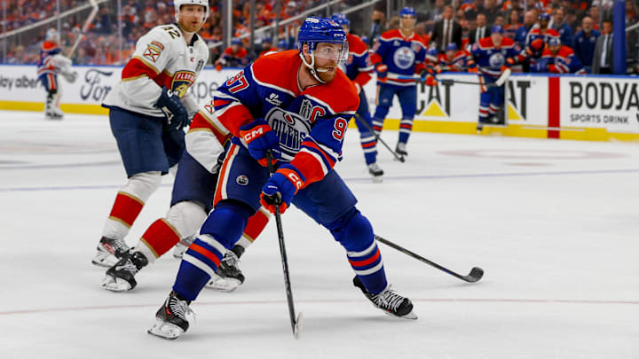 Jun 14, 2025; Edmonton, Alberta, CAN; Edmonton Oilers center Connor McDavid (97) controls the puck against Florida Panthers forward Aleksander Barkov (16) during the third period in game five of the 2025 Stanley Cup Final at Rogers Place. Mandatory Credit: Perry Nelson-Imagn Images