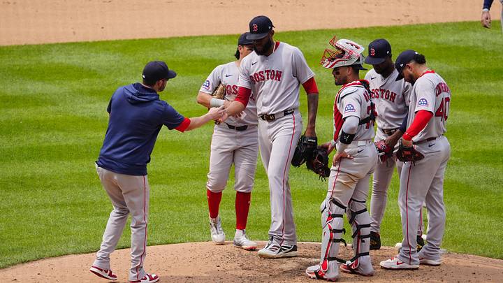 Jun 24, 2026; Denver, Colorado, USA; Boston Red Sox interim manager Chad Tracy (17) pulls relief pitcher Tyron Guerrero (41) in the seventh inning against the Colorado Rockies at Coors Field. Mandatory Credit: Ron Chenoy-Imagn Images