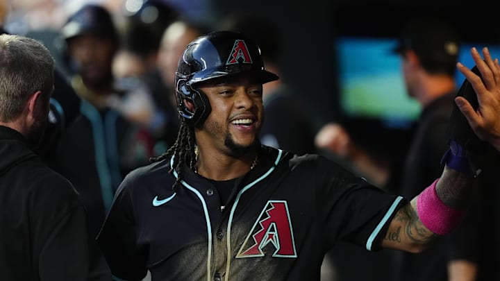 Arizona Diamondbacks second baseman Ketel Marte (4) celebrates scoring a run in the fourth inning against the Colorado Rockies at Coors Field.