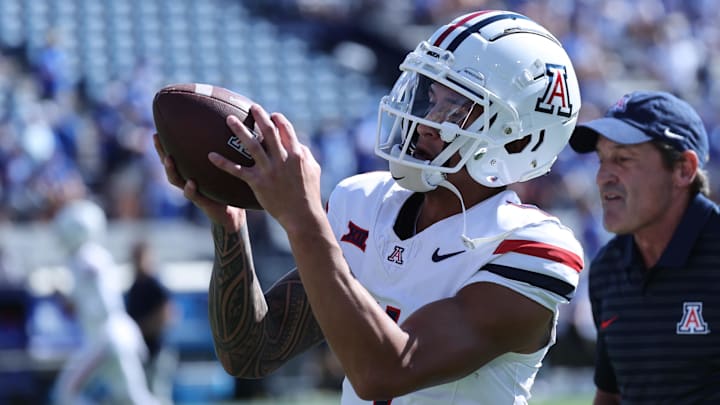 Oct 12, 2024; Provo, Utah, USA; Arizona Wildcats wide receiver Tetairoa McMillan (4) warms up before the game against the Brigham Young Cougars at LaVell Edwards Stadium