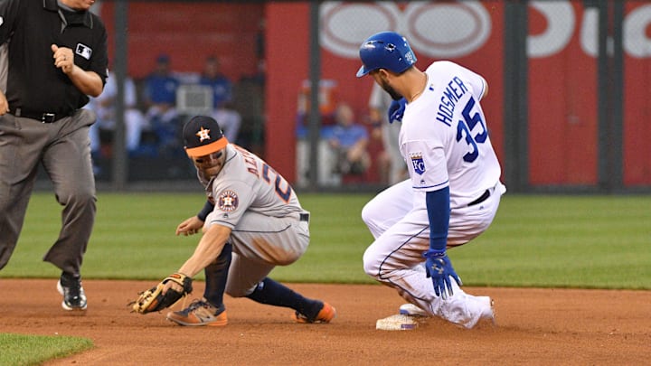 Jun 5, 2017; Kansas City, MO, USA; Houston Astros second baseman Jose Altuve (27) cannot make the tag as Kansas City Royals first baseman Eric Hosmer (35) hits a double in the fourth inning at Kauffman Stadium. Mandatory Credit: Denny Medley-Imagn Images