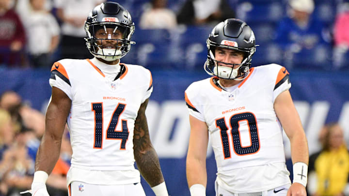Aug 11, 2024; Indianapolis, Indiana, USA; Denver Broncos wide receiver Courtland Sutton (14) and quarterback Bo Nix (10) stand on the field during warm ups before the game against the Indianapolis Colts at Lucas Oil Stadium. 