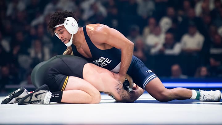 Penn State’s Carter Starocci, top, wrestles against Iowa's Angelo Ferrari during a Big Ten dual match at the Bryce Jordan Center.