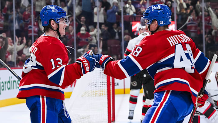 Oct 4, 2025; Montreal, Quebec, CAN; Montreal Canadiens right wing Cole Caufield (13) celebrates his goal against the Ottawa Senators with defenseman Lane Hutson (48) during the third period at Bell Centre. Mandatory Credit: David Kirouac-Imagn Images