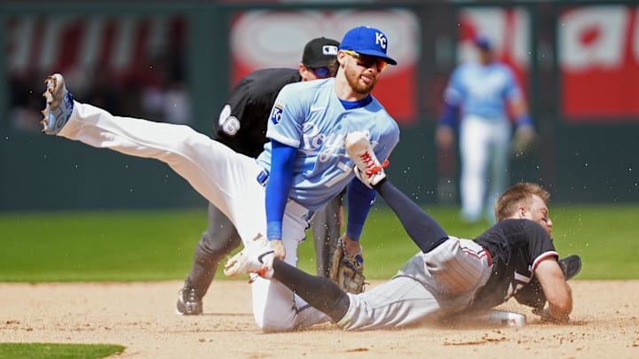 Apr 2, 2026: Minnesota Twins second baseman Kody Clemens (2) is tagged out at second base by Kansas City Royals shortstop Bobby Witt Jr. (7) during the fifth inning at Kauffman Stadium. 