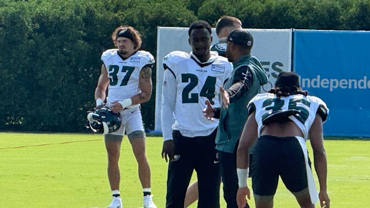 Rookie Drew Mukuba gets instruction from DB coach Christian Parker during Day 8 of Eagles training camp.