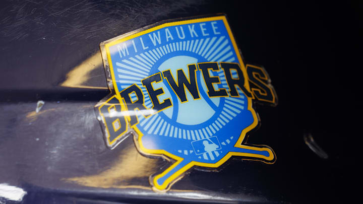 Jun 18, 2023; Milwaukee, Wisconsin, USA;  A Milwaukee Brewers logo on a batting helmet in the dugout prior to the game against the Pittsburgh Pirates at American Family Field. Mandatory Credit: Jeff Hanisch-Imagn Images