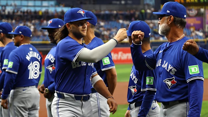 Mar 28, 2024: Toronto Blue Jays shortstop Bo Bichette (11)  is introduced against the Tampa Bay Rays prior to the game on opening day at Tropicana Field. 