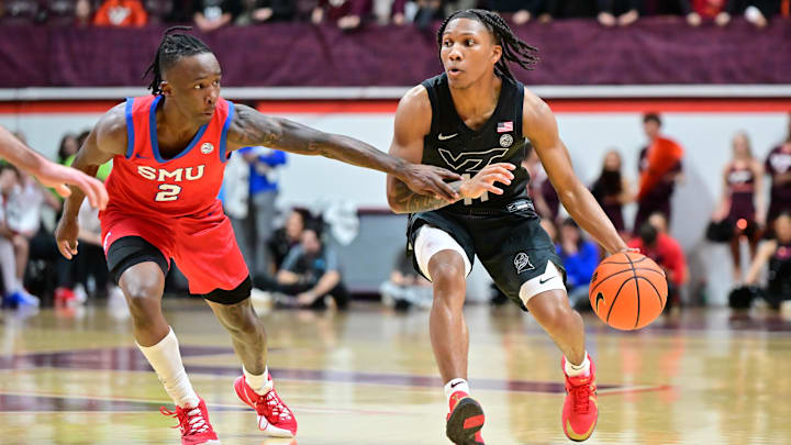 Feb 5, 2025; Virginia Tech guard Ben Hammond (11) controls the ball while being defended by SMU guard Boopie Miller (2).