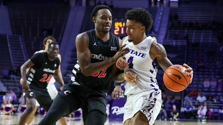 Feb 11, 2026; Manhattan, Kansas, USA; Kansas State Wildcats guard P.J. Haggerty (4) is guarded by Cincinnati Bearcats guard Jalen Celestine (32) during the second half at Bramlage Coliseum. Feb 11, 2026; Manhattan, Kansas, USA; Kansas State Wildcats guard P.J. Haggerty (4) is guarded by Cincinnati Bearcats guard Jalen Celestine (32) during the second half at Bramlage Coliseum.