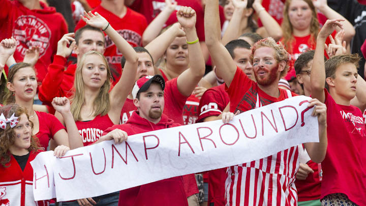 Wisconsin Badgers fans take part in the traditional Jump Around between the third and fourth quarters against the Wisconsin Badgers at Camp Randall Stadium. Wisconsin Badgers fans take part in the traditional Jump Around between the third and fourth quarters against the Wisconsin Badgers at Camp Randall Stadium.