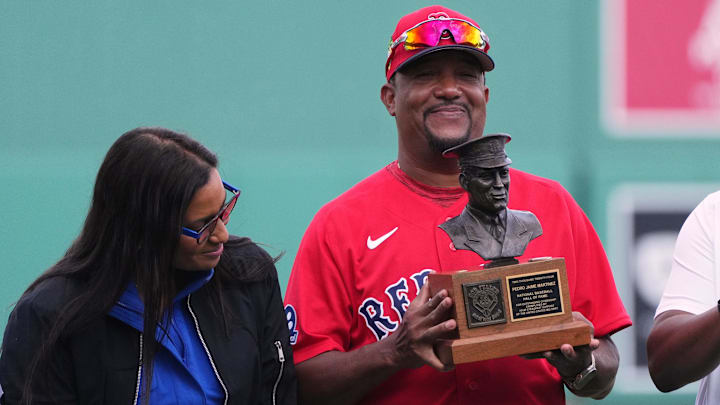 Feb 26, 2026; Fort Myers, Florida, USA;  Former Boston Red Sox pitcher and hall of fame member Pedro Martinez receives the Bob Feller Act of Valor Award before the game against the Tampa Bay Rays at JetBlue Park at Fenway South. Mandatory Credit: Jim Rassol-Imagn Images