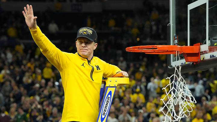 Apr 6, 2026; Indianapolis, IN, USA; Michigan Wolverines head coach Dusty May waves to the crowd as he cuts down the net after defeating the Connecticut Huskies in the national championship of the Final Four of the men's 2026 NCAA Tournament at Lucas Oil Stadium. Mandatory Credit: Robert Deutsch-Imagn Images Apr 6, 2026; Indianapolis, IN, USA; Michigan Wolverines head coach Dusty May waves to the crowd as he cuts down the net after defeating the Connecticut Huskies in the national championship of the Final Four of the men's 2026 NCAA Tournament at Lucas Oil Stadium. Mandatory Credit: Robert Deutsch-Imagn Images
