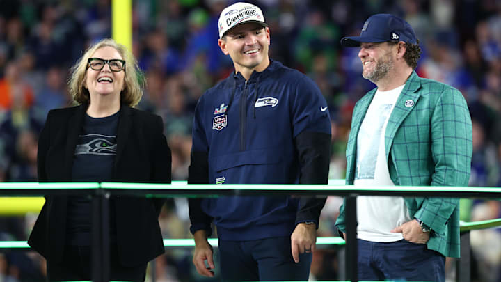 Seattle Seahawks chairman Jody Allen, head coach Mike MacDonald, and general manager John Schneider on the podium. Seattle Seahawks chairman Jody Allen, head coach Mike MacDonald, and general manager John Schneider on the podium.