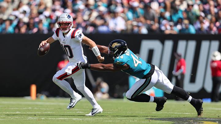 Sep 27, 2026; Jacksonville, Florida, USA;  New England Patriots quarterback Drake Maye (10) runs for a gain past Jacksonville Jaguars defensive end Travon Walker (44) during the first quarter at EverBank Stadium.  Mandatory Credit: Morgan Tencza-Imagn Images